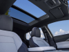 2024-chevrolet-equinox-ev-3lt-sky-cool-gray-press-photo-interior-002-leather-front-seats-center-armrest-panoramic-sunroof