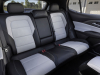2024-chevrolet-equinox-ev-3lt-sky-cool-gray-press-photo-interior-003-leather-rear-seats-fold-down-armrest-rear-window