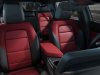 2024-chevrolet-equinox-ev-3rs-black-red-press-photo-interior-002-leather-front-seats-center-armrest-infotainment-screen-display-chevy-logo