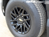2024-chevrolet-silverado-ev-wt-work-truck-first-drive-exterior-089-bridgestone-alenza-tire-18-inch-gloss-black-wheel