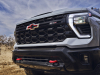 2024-chevrolet-silverado-2500-hd-zr2-press-photos-exterior-017-front-front-fascia-red-chevy-flowtie-on-grille