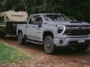 2024-chevrolet-silverado-2500hd-australia-and-nz-press-photos-exterior-006-side-front-three-quarters-drl-daytime-running-lights-towing-trailer