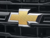 2024-chevrolet-silverado-3500hd-wt-chassis-cab-mexico-press-photos-exterior-004-gold-chevy-bowtie-logo-badge-on-grille
