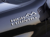 2024-chevrolet-silverado-hd-high-country-press-photos-exterior-012-driver-side-front-fender-high-country-logo-badge