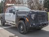 2024-chevrolet-silverado-hd-high-country-refresh-prototype-spy-shots-april-2022-exterior-003-front-end-front-three-quarters