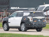 2024-chevrolet-tahoe-high-country-refresh-prototype-spy-shots-22-inch-sterling-silver-premium-painted-wheels-with-chrome-inserts-may-2023-exterior-010