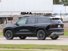 2024-chevrolet-traverse-lt-mosaic-black-metallic-gb8-first-on-the-road-pictures-exterior-006-side-rear-three-quarters-tail-lights