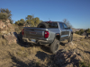 2024-gmc-canyon-at4x-aev-edition-media-drive-exterior-004-rear-three-quarters-tail-lights-suspension-articulation