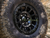 2024-gmc-canyon-at4x-aev-edition-press-photos-exterior-007-goodyear-wrangler-territory-mt-tire-17-inch-gloss-black-beadlock-wheel