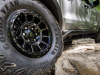 2024-gmc-canyon-at4x-aev-edition-press-photos-exterior-008-goodyear-wrangler-territory-mt-tire-17-inch-gloss-black-beadlock-wheel