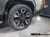 2024-gmc-sierra-ev-denali-edition-1-live-photos-exterior-017-rear-24-inch-wheel-tire