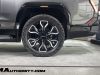 2024-gmc-sierra-ev-denali-edition-1-live-photos-exterior-018-rear-fender-rear-24-inch-wheel-tire