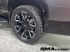 2024-gmc-sierra-ev-denali-edition-1-live-photos-exterior-019-rear-24-inch-wheel-tire