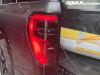 2024-gmc-sierra-ev-denali-edition-1-live-photos-exterior-022-driver-side-tail-light