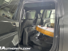 2024-gmc-sierra-ev-denali-edition-1-live-photos-interior-009-rear-seat-multipro-midgate-folded