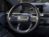 2024-gmc-sierra-ev-denali-edition-1-press-photos-interior-002-digital-instrument-panel-gauge-cluster-denali-script-on-steering-wheel