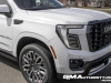 2025-gmc-yukon-denali-ultimate-white-frost-tricoat-g1w-prototype-spy-shots-undisguised-april-2024-exterior-001-front-three-quarters-headlight-grille