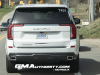 2025-gmc-yukon-denali-ultimate-white-frost-tricoat-g1w-prototype-spy-shots-undisguised-april-2024-exterior-005-rear-tail-lights-exhaust
