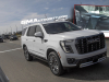 2025-gmc-yukon-denali-ultimate-white-frost-tricoat-g1w-prototype-spy-shots-undisguised-april-2024-exterior-007-front-three-quarters
