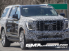 2025-gmc-yukon-xl-denali-ultimate-prototype-spy-shots-little-camo-march-2024-exterior-001-front-front-fascia-drl-daytime-running-lights
