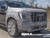 2025-gmc-yukon-xl-denali-ultimate-prototype-spy-shots-little-camo-march-2024-exterior-003-front-front-fascia-grille-drl-daytime-running-lights
