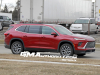 2025-buick-enclave-prototype-spy-shots-no-camouflage-red-february-2024-exterior-003-side-front-three-quarters