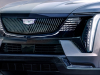 2025-cadillac-escalade-iq-sport-reveal-photos-exterior-008-front-front-fascia-cadillac-logo-badge-on-led-grille-drl-daytime-running-lights