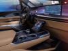 2025-cadillac-escalade-iq-sport-reveal-photos-interior-002-cockpit-digital-instrument-panel-gauge-cluster-horizontal-infotainment-display-screen-center-stack-center-console-cup-holders