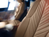 2025-cadillac-escalade-iq-sport-reveal-photos-interior-007-front-seat-stitching-detail-on-seatback