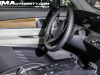 2026-cadillac-vistiq-prototype-spy-shots-february-2024-interior-004-steering-wheel-door-panel