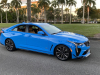 2022-cadillac-ct4-v-blackwing-gma-garage-electric-blue-exterior-005-side-front-three-quarters