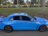 2022-cadillac-ct4-v-blackwing-gma-garage-electric-blue-exterior-018-side-high-angle