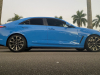 2022-cadillac-ct4-v-blackwing-gma-garage-electric-blue-exterior-019-side-low-angle