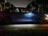 2022-cadillac-ct4-v-blackwing-gma-garage-electric-blue-exterior-026-side-puddle-light-cabin-lights-at-night