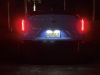 2022-cadillac-ct4-v-blackwing-gma-garage-electric-blue-exterior-056-tail-lamps-at-night