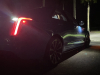 2022-cadillac-ct4-v-blackwing-gma-garage-electric-blue-exterior-061-tail-lamps-with-reverse-lights-puddle-light-at-night
