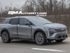 2025-cadillac-optiq-sport-gray-chinese-market-model-first-on-the-road-photos-december-2023-exterior-002-side-front-three-quarters