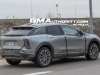 2025-cadillac-optiq-sport-gray-chinese-market-model-first-on-the-road-photos-december-2023-exterior-004-side-rear-three-quarters