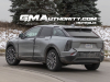 2025-cadillac-optiq-sport-gray-chinese-market-model-first-on-the-road-photos-december-2023-exterior-007-side-rear-three-quarters