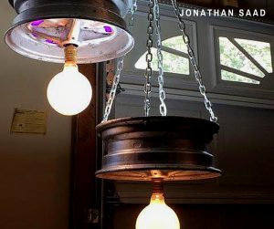 A pair of chandeliers made by Jonathan Saad. 