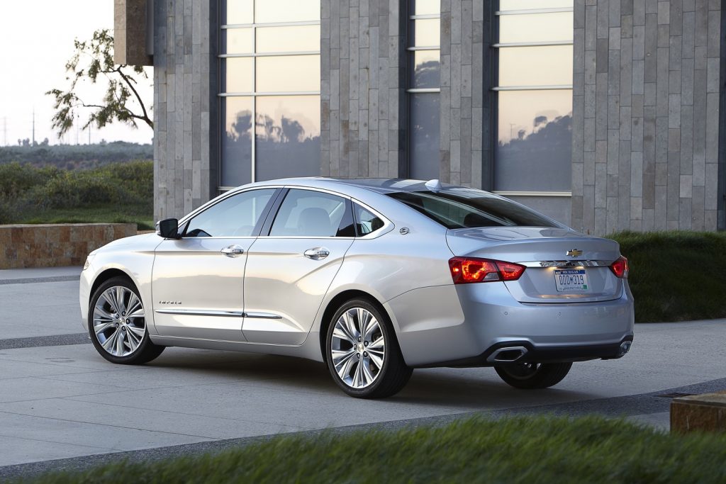 Rear three quarters view of a 2016 Chevy Impala, subject of a class action lawsuit versus GM.