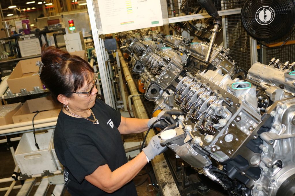 Worker assembling a Duramax engine at the GM DMAX Moraine engine plant in Ohio.