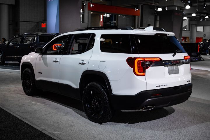 Low-interest financing with no monthly payments for 90 days is still offered on the GMC Acadia, shown here in the off-road-oriented AT4 trim. A larger, next-gen model debuted for the 2024 model year.