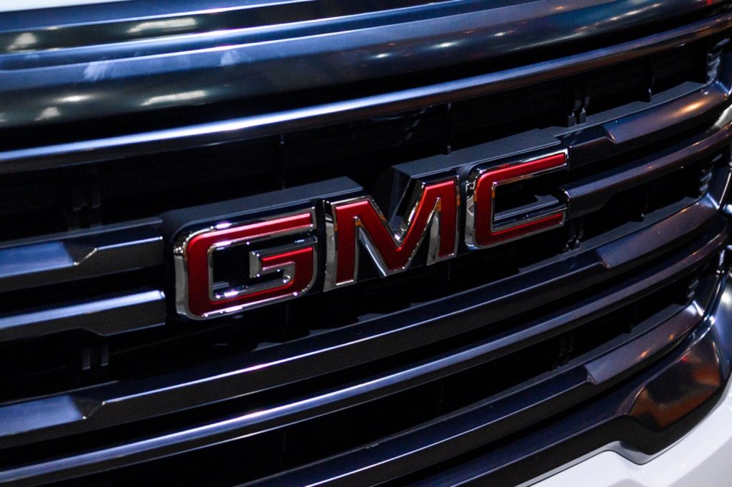The GMC logo on the grille of the second-gen Acadia, including the 2023 GMC Acadia.