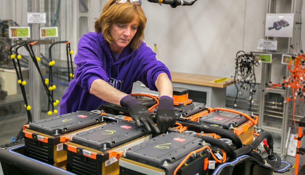 A worker producing batteries at the GM Brownstown plant.