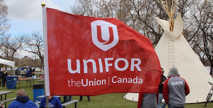 Unifor flag at a demonstration.