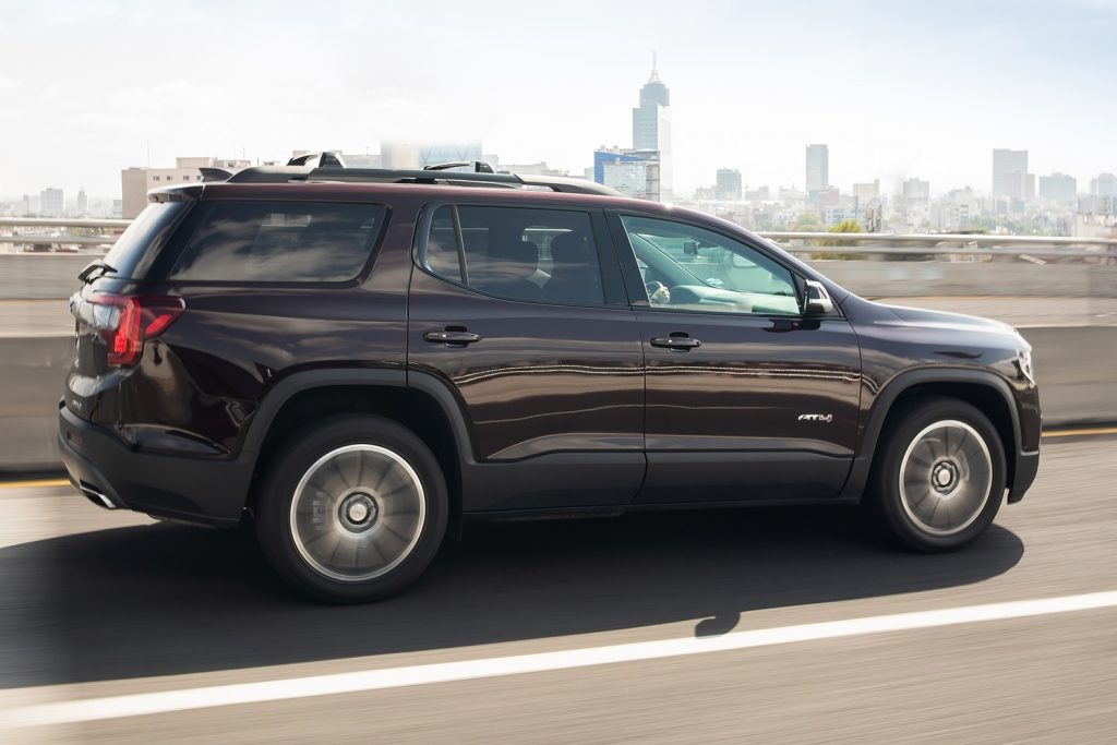 Low-interest financing with monthly payments deferred till 2024 continues to be offered on the GMC Acadia, shown here in the off-road-oriented AT4 trim. A larger, next-gen model recently debuted for the 2024 model year.