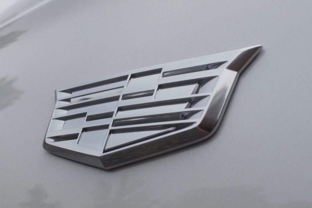 The Cadillac badge on an XT6 fender.