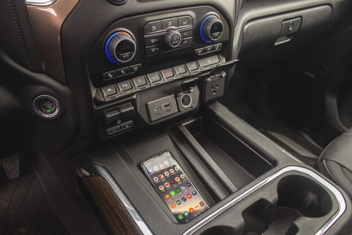 An iPhone charges in a GM vehicle.