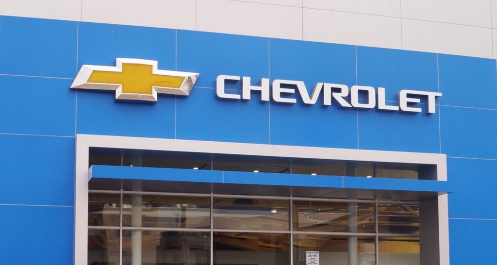 The entrance of a Chevy dealership.